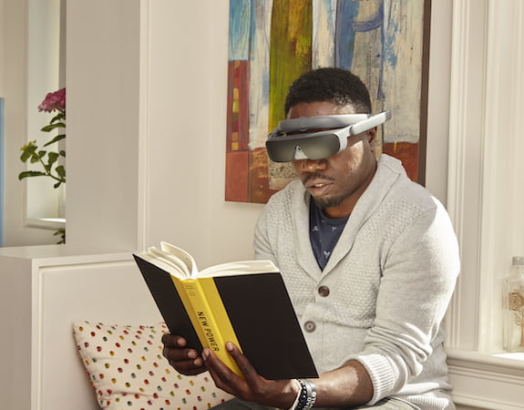 Man reading book with eSight