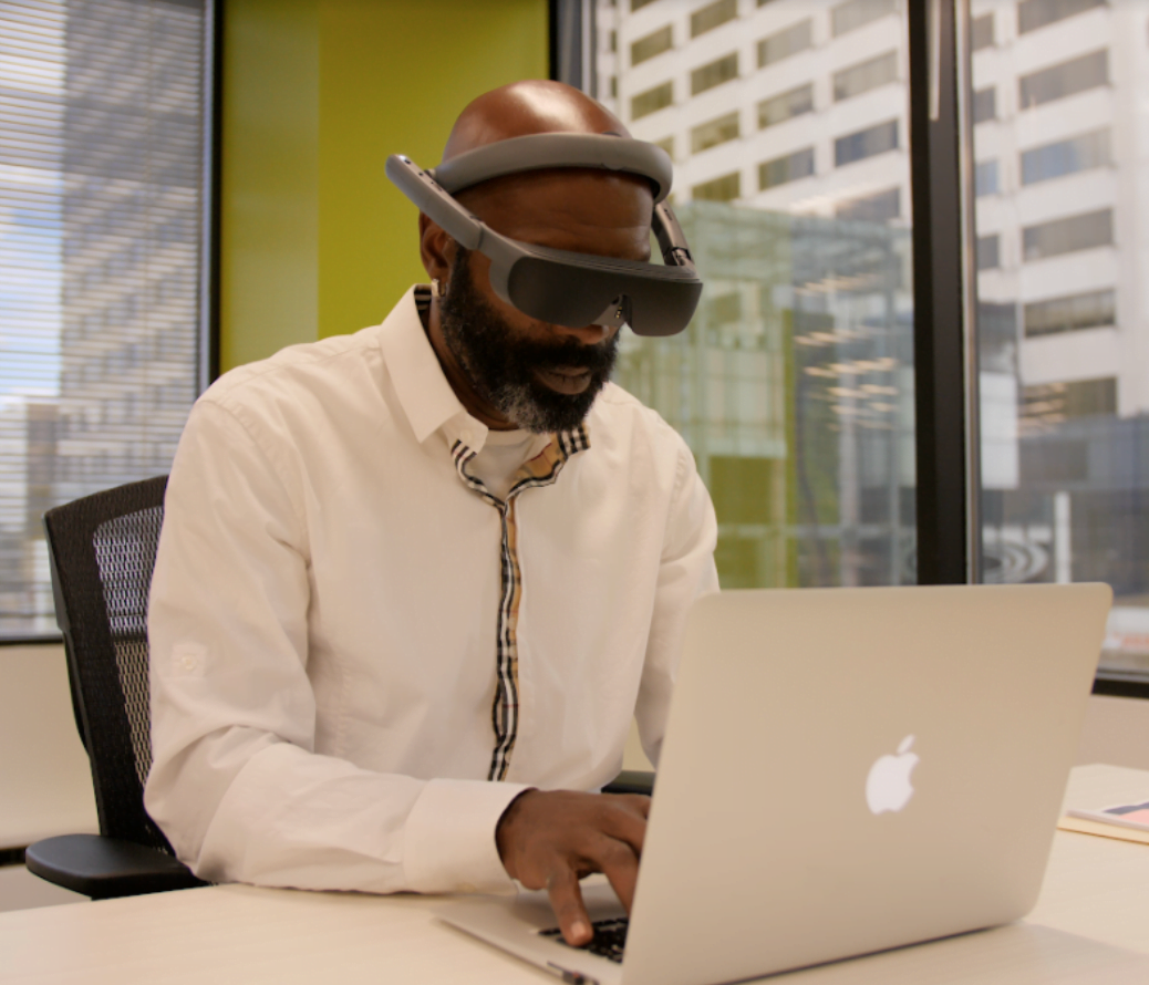 Man working on computer with eSight 4