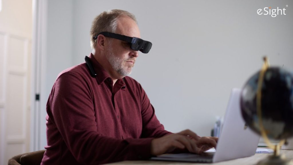 a man wearing a headset and using a laptop