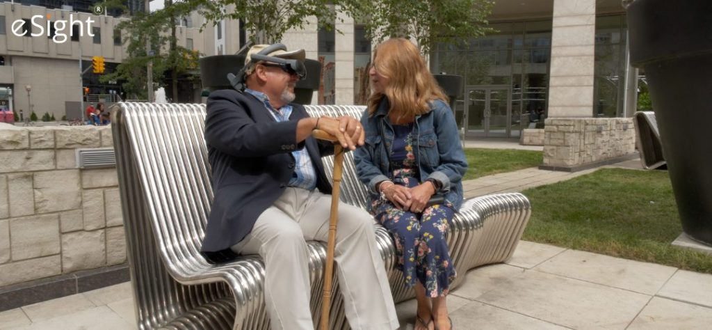 a man and woman sitting on a bench