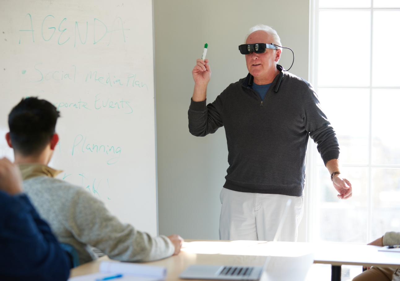Man looking at prescription bottle