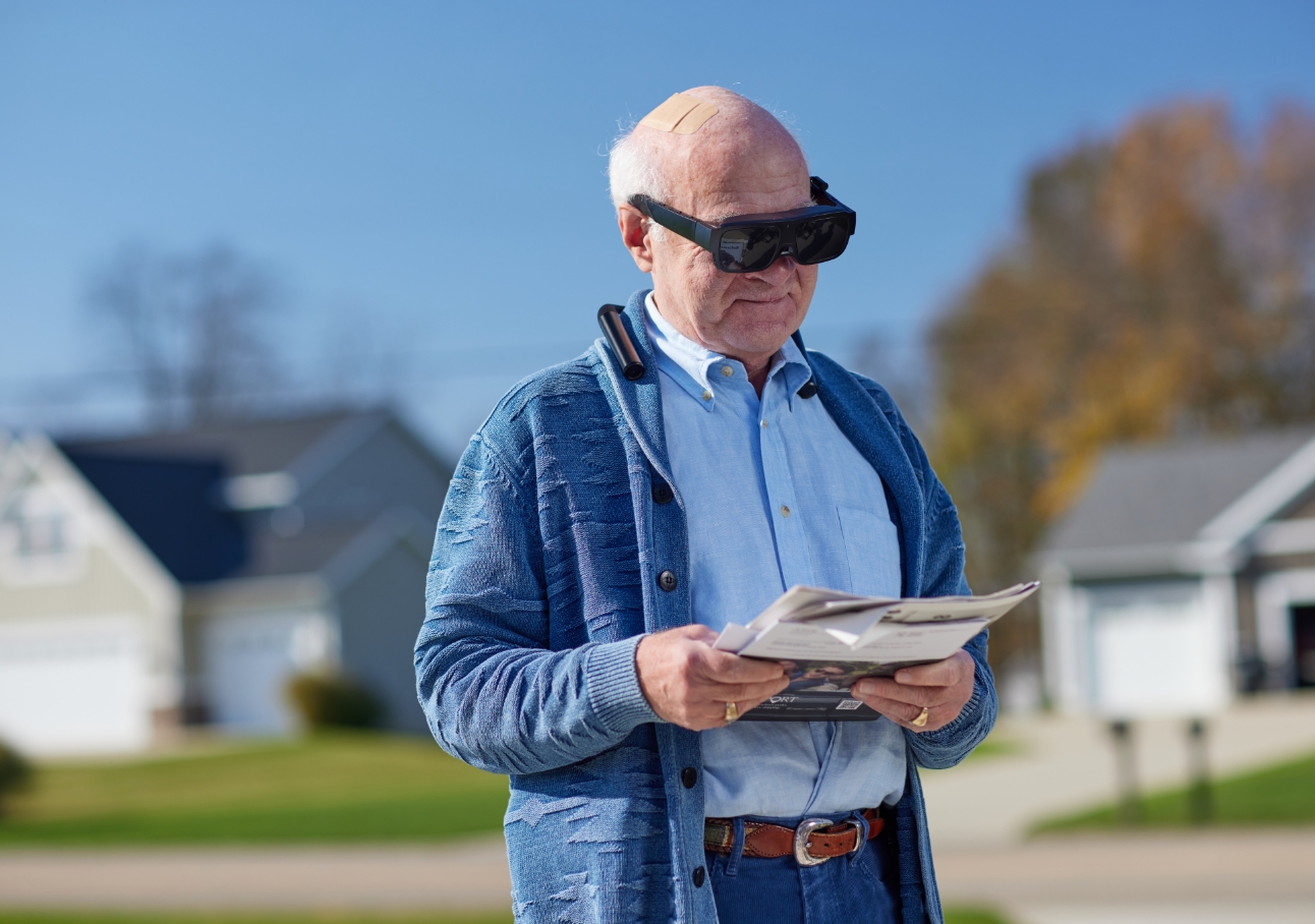 Man looking at prescription bottle
